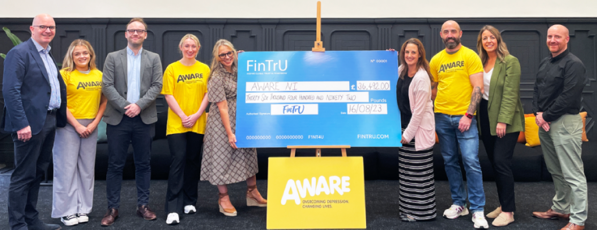 FinTrU Presents AWARE NI with &pound;36,492 Cheque for taking GIANT STEPS for mental health!